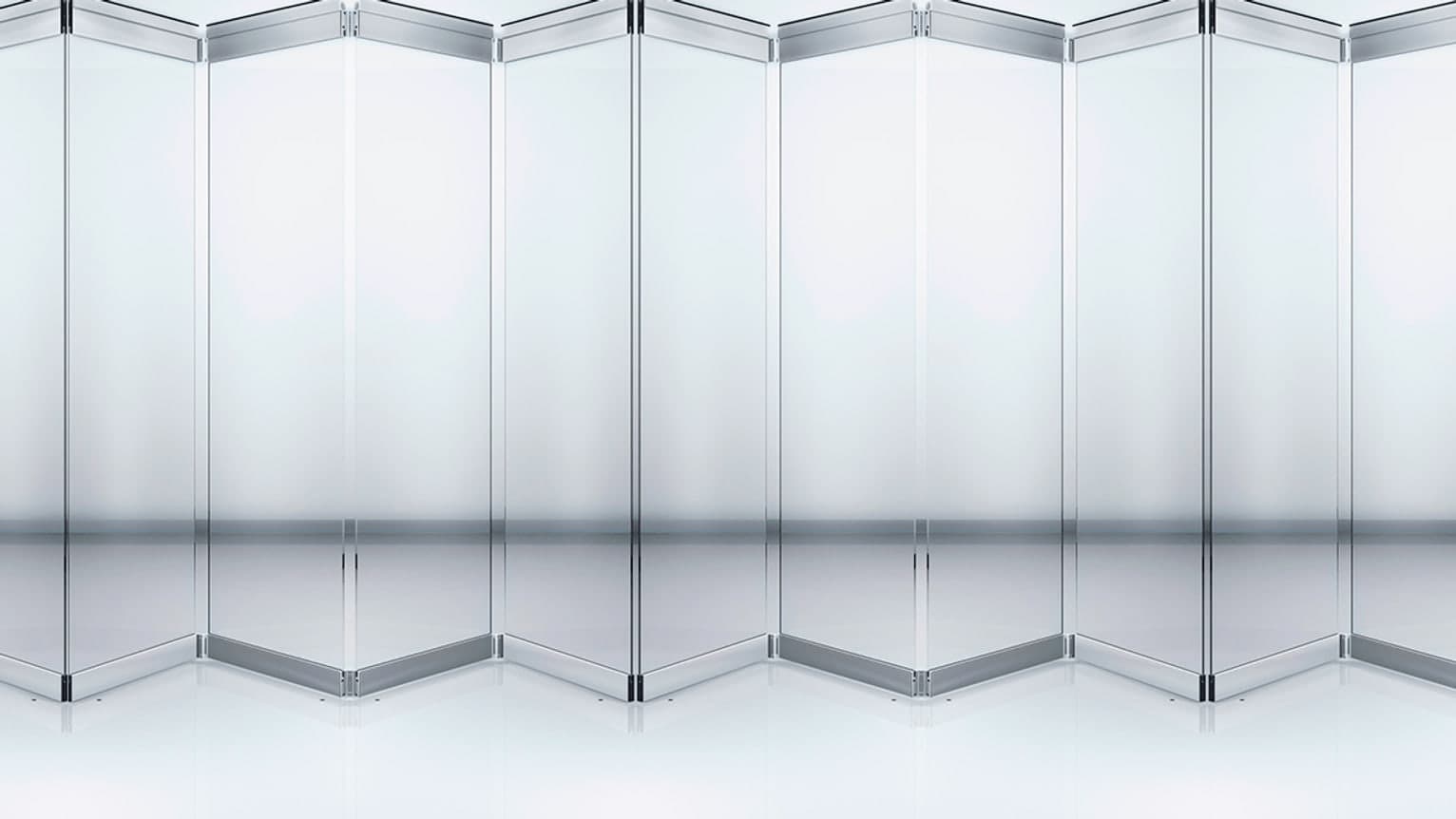 A glazed operable wall with its panels folded into a concertina